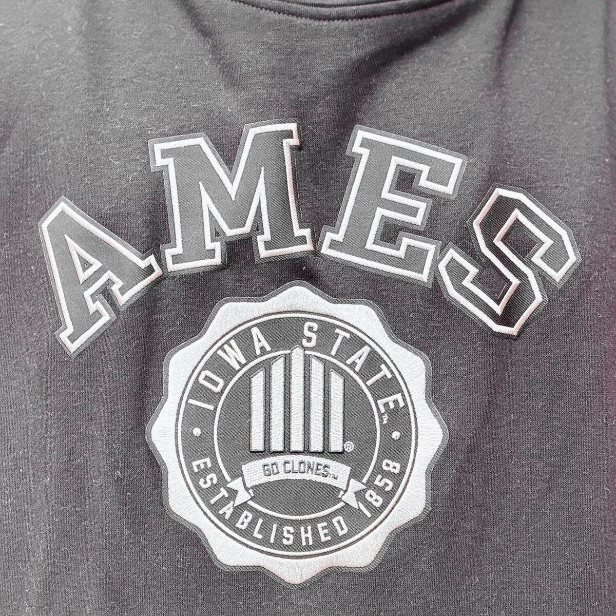 Antigua 5-Bar Black Victory Seal Hooded Sweatshirt design close up